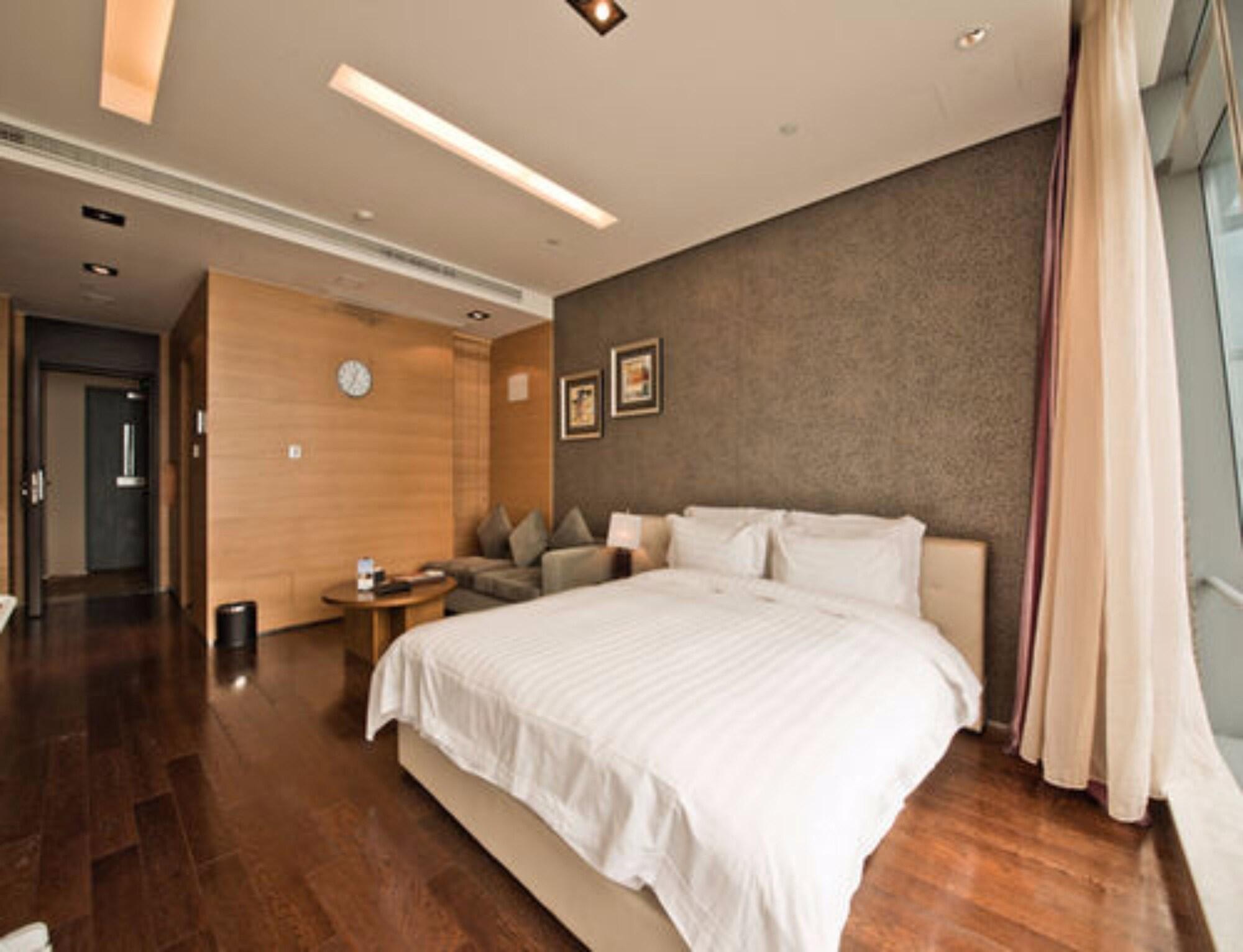 Grand Madison Qingdao Harbour-View Central（Former Qingdao Farglory Hotel） Экстерьер фото